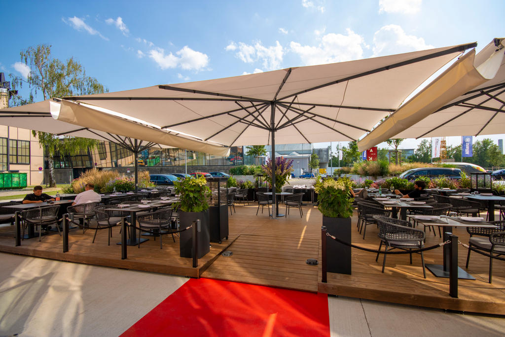 Patio with beige parasols