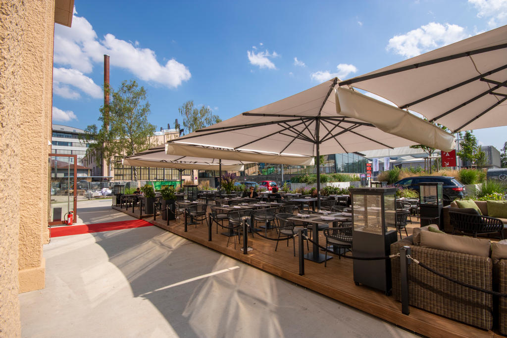 Patio with beige parasols