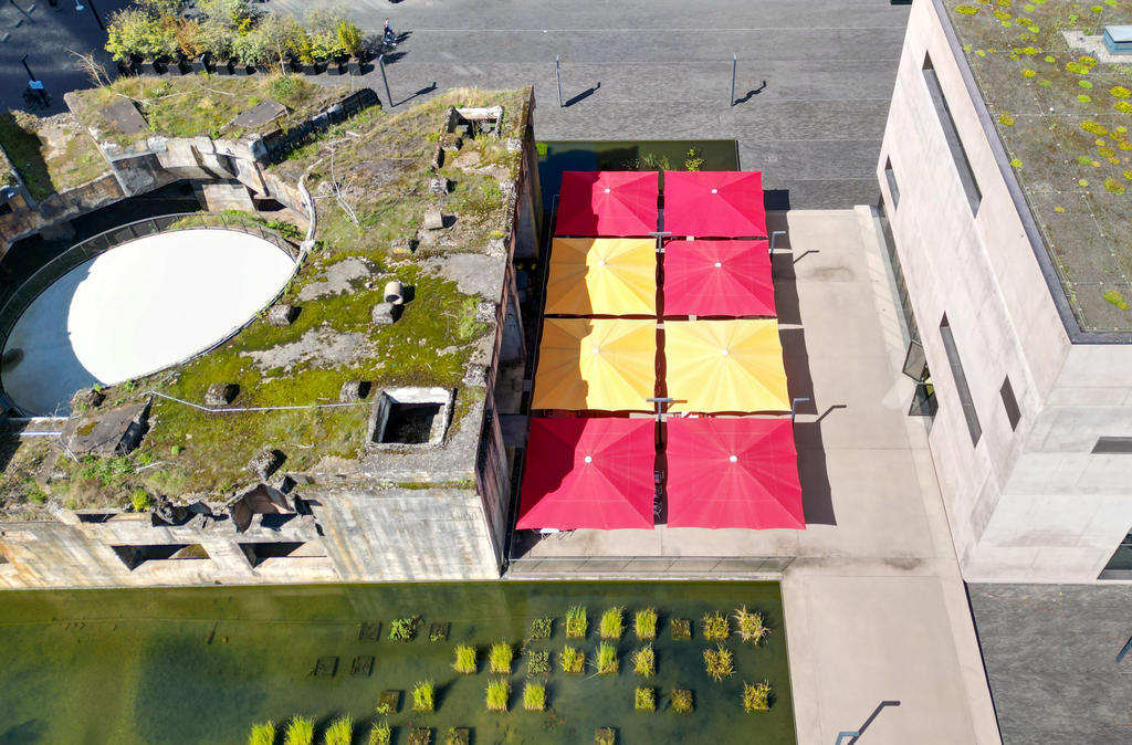 Terrace with red and yellow parasols