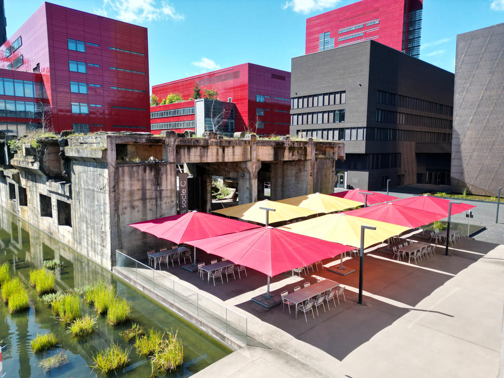 Terrace with red and yellow parasols