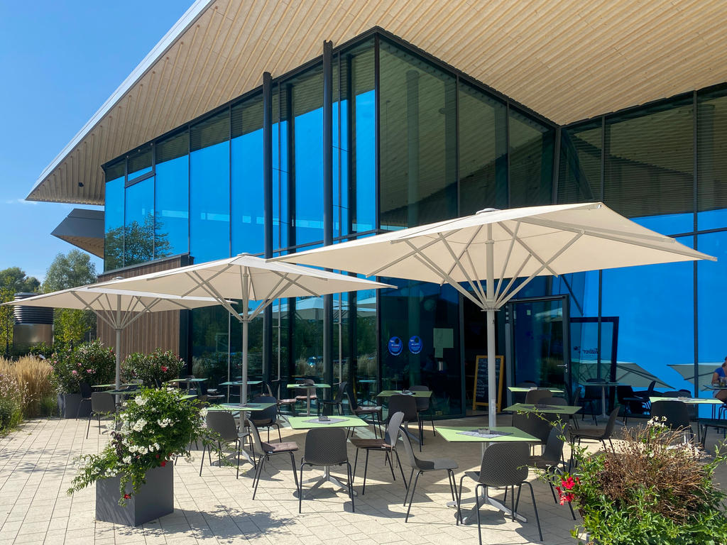 Large white parasols on a terrace