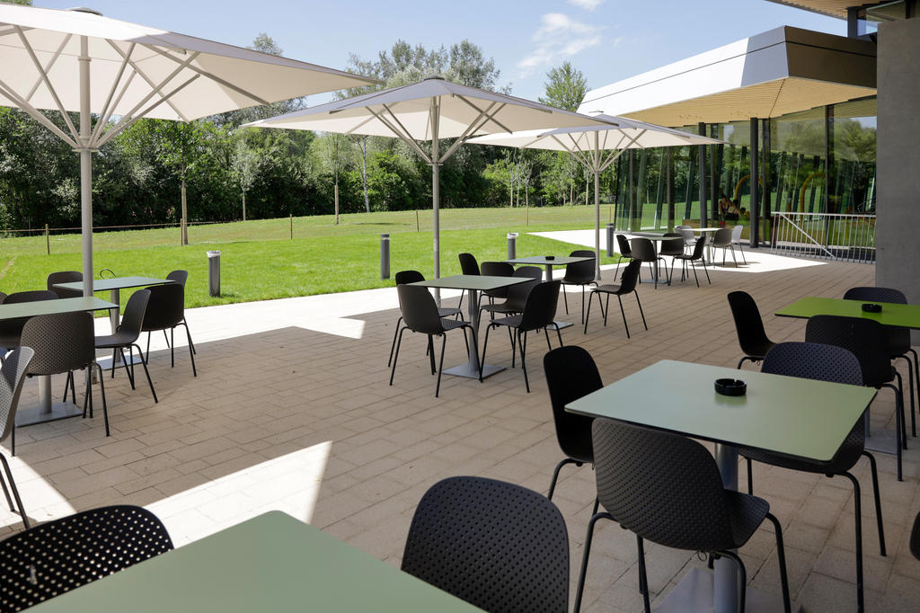 Large white parasols on a terrace