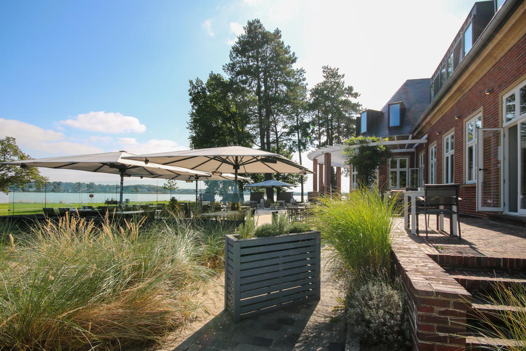 Patio with beige parasols