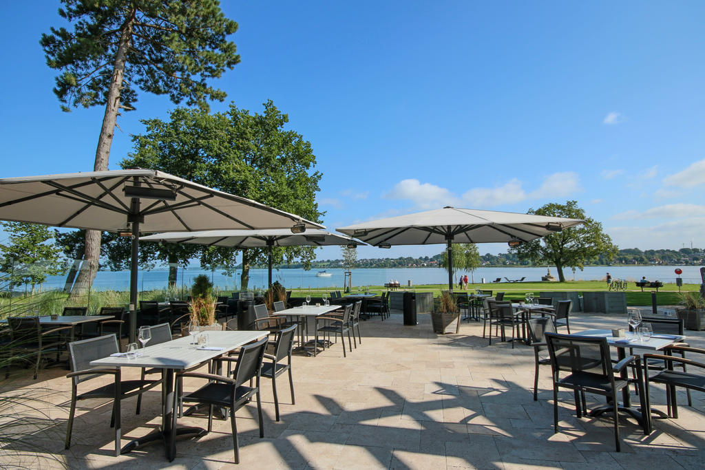 Patio with beige parasols