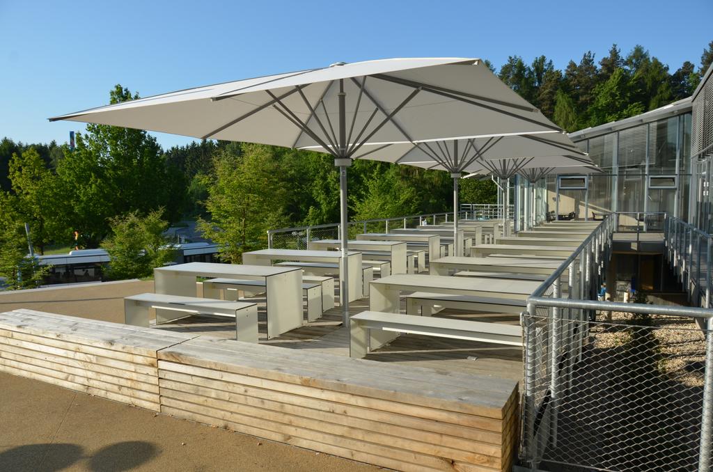 Patio with white parasols