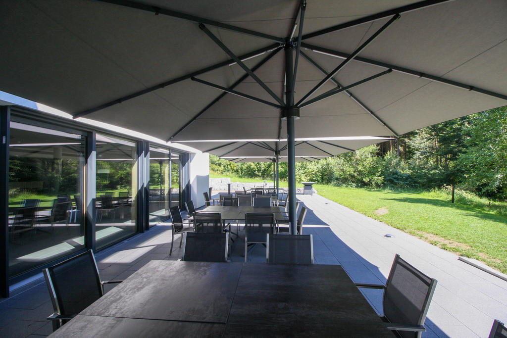 Terrace with grey parasols