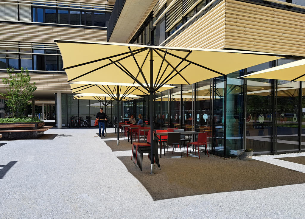 Terrace with large yellow parasols