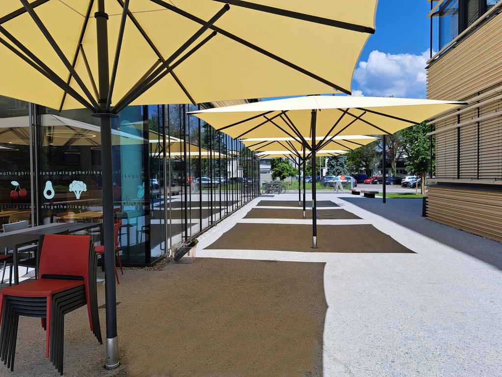 Terrace with large yellow parasols