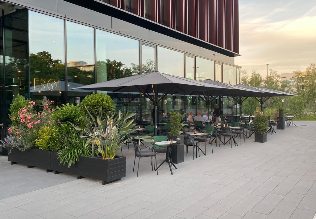 Patio with gray parasols