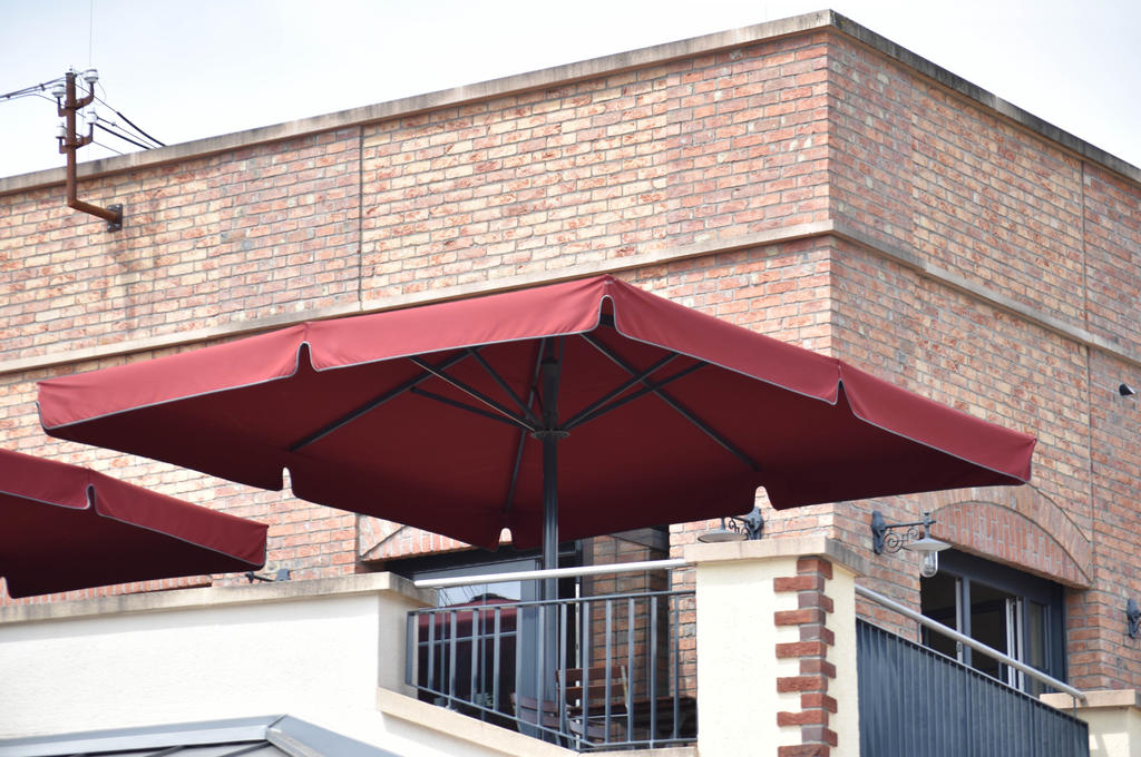Theme park terrace with red parasols