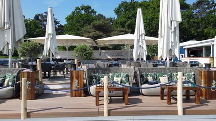 Terrace with white parasols