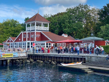 Patio at the sea with red parasols