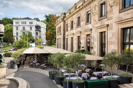 Patio with beige parasols