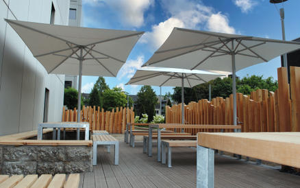 Terrace with white parasols