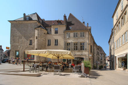 Patio with beige parasols