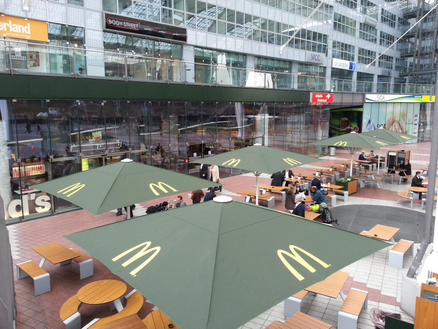 McDonald's Munich with green SCHATTELLO parasols Patio with green parasols