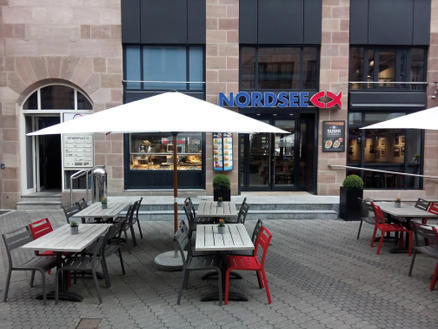 Patio with white parasols