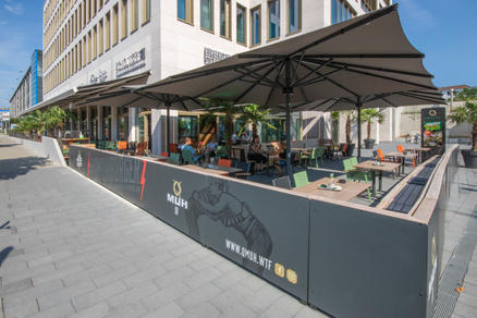 Patio with dark parasols