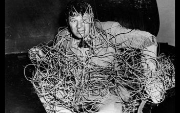 USB A/B/C/Mini/Micro & Thunderbolt 1/2/3 & Mini DisplayPort – Are you confused yet? Man tangled in cables