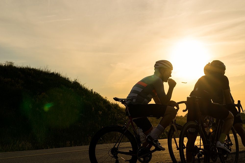 Cyclists backlit by sun © Jeff Becker
