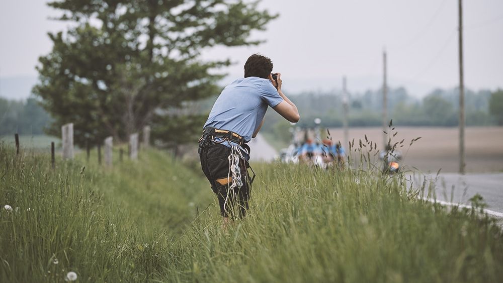 Photographer by the side of the road