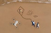 DJI Mini 2 – DJI’s Latest Palm Sized Drone Offers Loads of Improvements DJI Mini 2 in air above beach