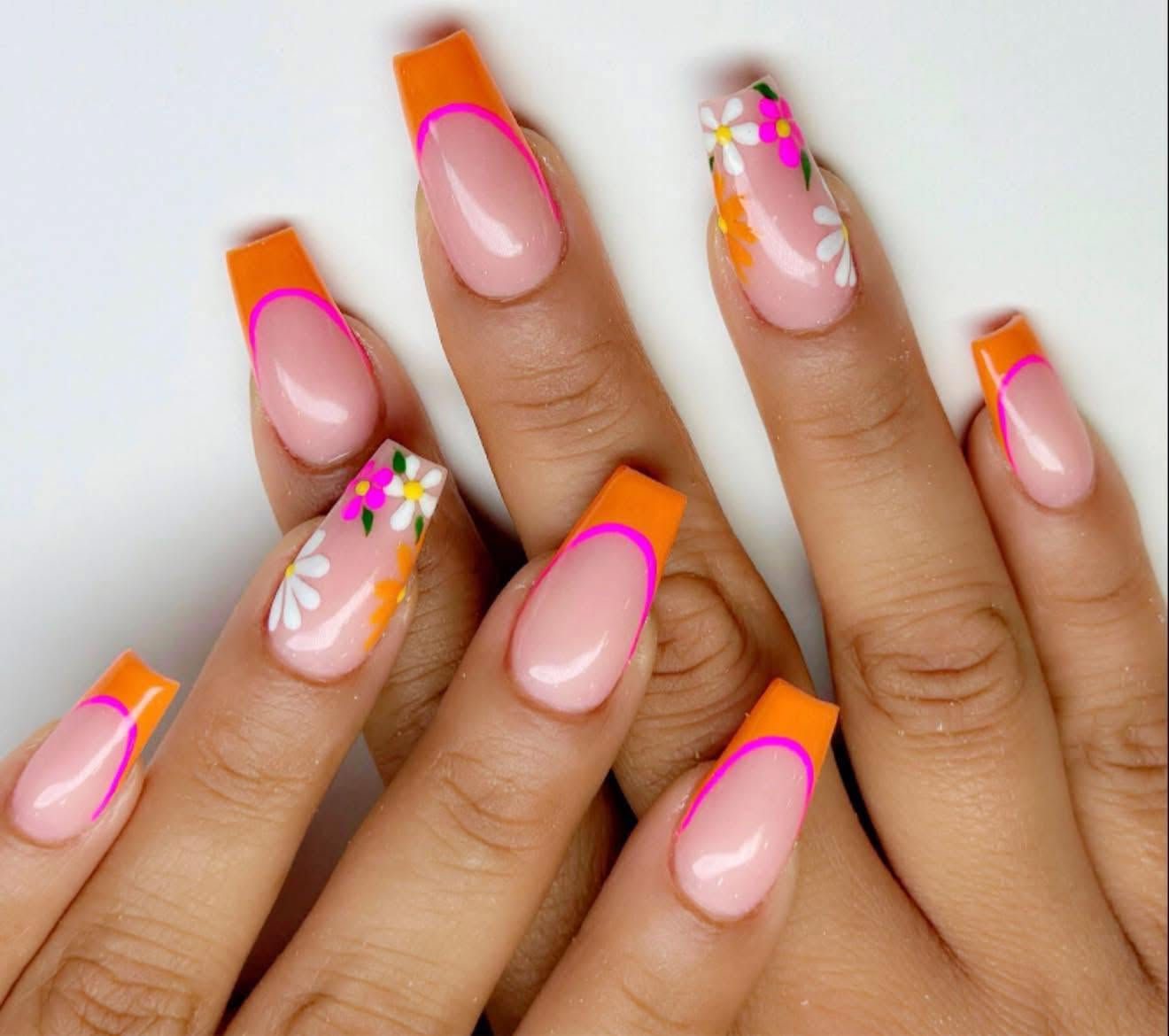 Orange and floral nail art by A1 Nails