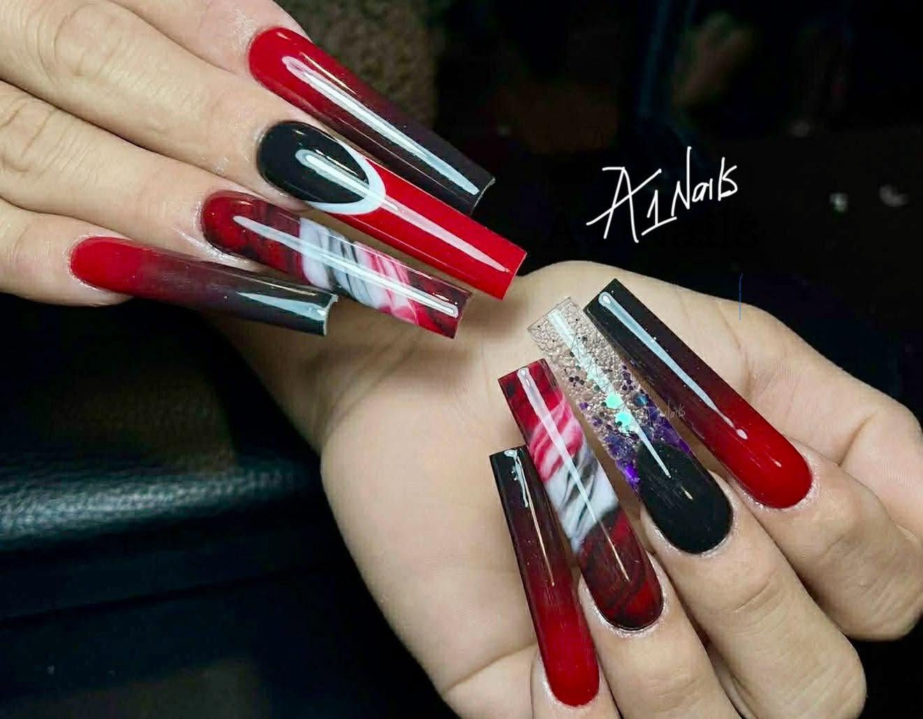 Red and black acrylic nail design by A1 Nails