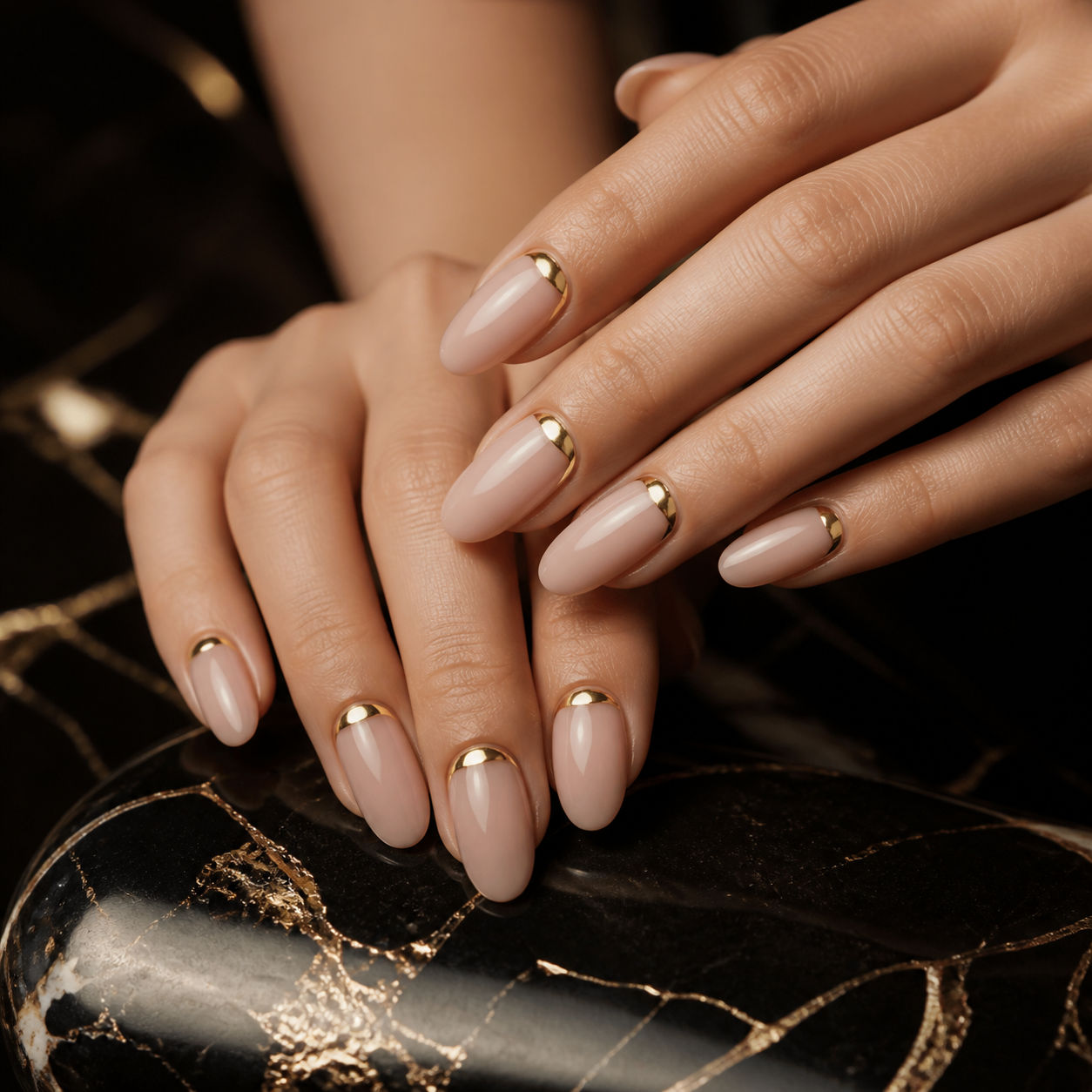 Nude manicure finished with fine gold details