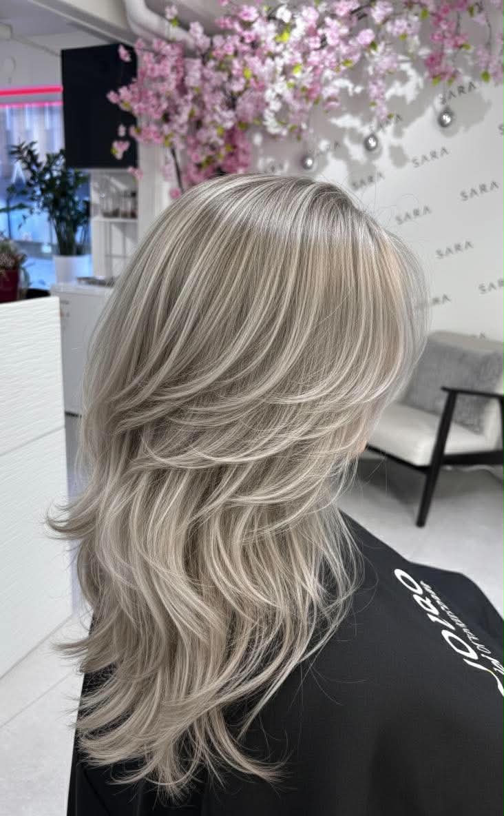 Soft digital perm and styled hair at Sara Beauty