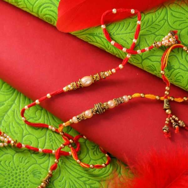 Set of 2 Golden Pearl Rakhis With Decorated Thread