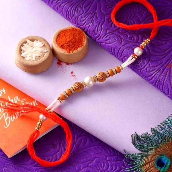 OM Rakhi With Silver Pearls