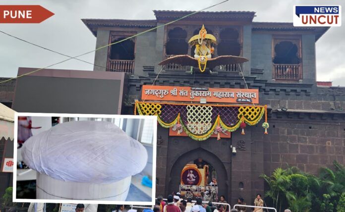 Shri Kshetra Dehu's Sant Tukaram Maharaj temple decorated for the unveiling ceremony of the world's largest turban, featuring a grand entrance adorned with flowers and a prominent Garuda statue above the gate. Inset image shows a close-up of the massive white turban, crafted from 450 meters of fabric.