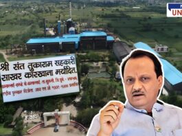 An aerial view of Shri Sant Tukaram Cooperative Sugar Factory with a large sign displaying the factory’s name and details. A cutout of Ajit Pawar is placed in the foreground, indicating his involvement in the sugar factory’s election process.