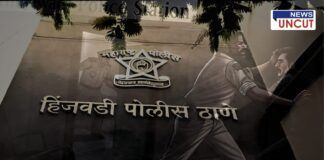 Illustration of a tense moment outside Hinjewadi Police Station, Pune, Maharashtra, India. A man in simple clothing is seen aggressively attacking a uniformed police officer, pushing him against a wall. The police station's nameplate and Maharashtra Police emblem are prominently visible in the background. The scene is dark and intense, capturing the seriousness of the incident where an officer was assaulted inside the station premises.