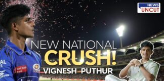 A stadium at night with bright floodlights and fireworks in the sky. On the left, a young cricketer in a Mumbai Indians jersey looks ahead with focus. On the right, the same person is sitting casually in a white outfit, smiling. Bold text in the center reads 'New National Crush! Vignesh Puthur.' The scene captures his rising fame and viral popularity.