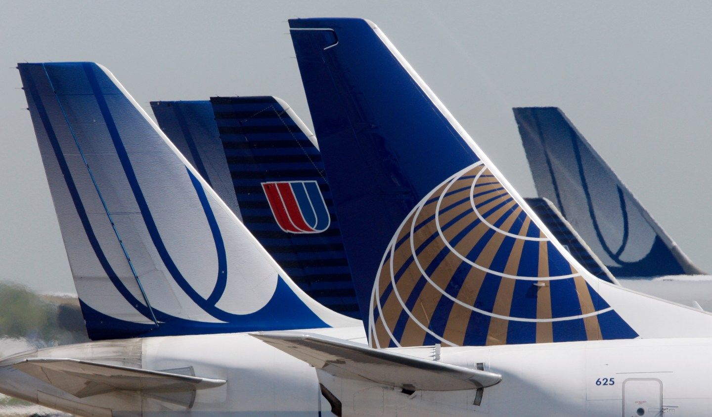A Continental Airlines plane is parked next to United Airlines planes in Chicago
