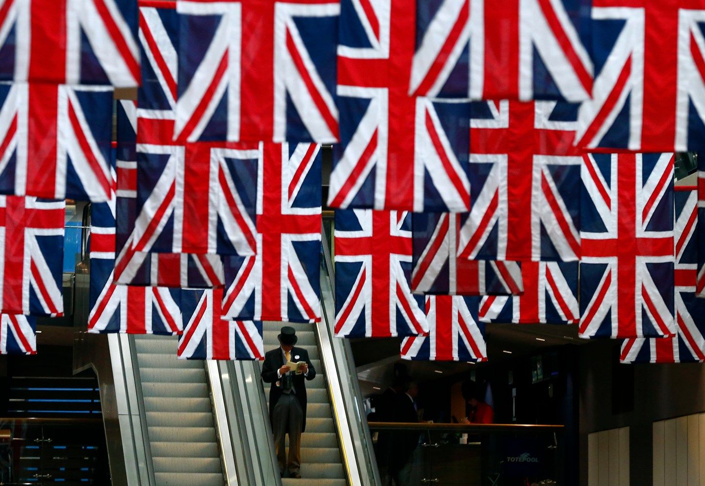 A man reads a race card during the first day of the Royal Ascot horse racing festival at Ascot