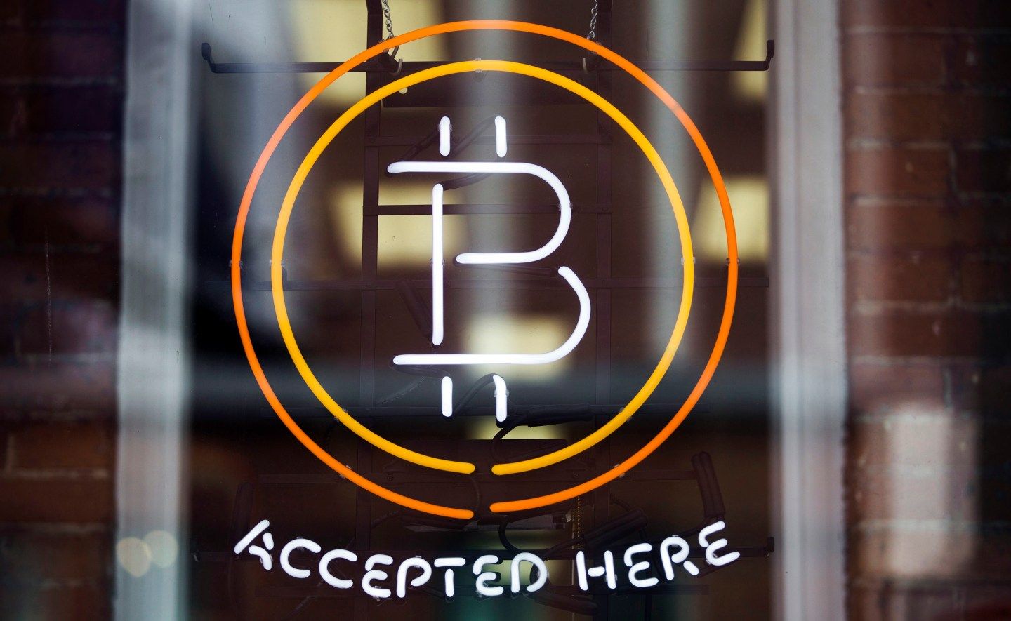 A Bitcoin sign is seen in a window in Toronto