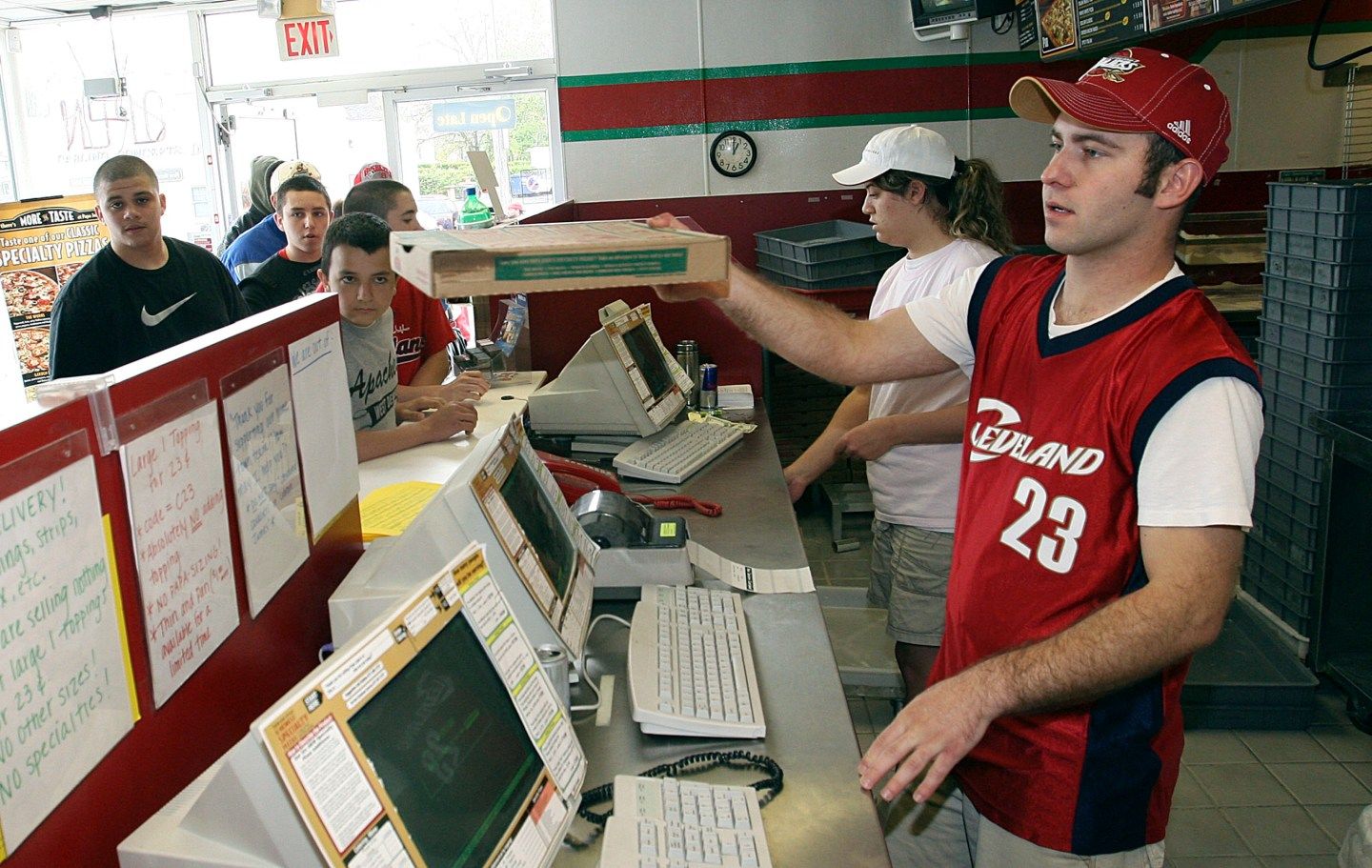 Papa Johns worker hands out pizzas in response to Washington D.C. Papa Johns promotion in which Cavaliers James was shown on shirts as cry baby in Lakewood
