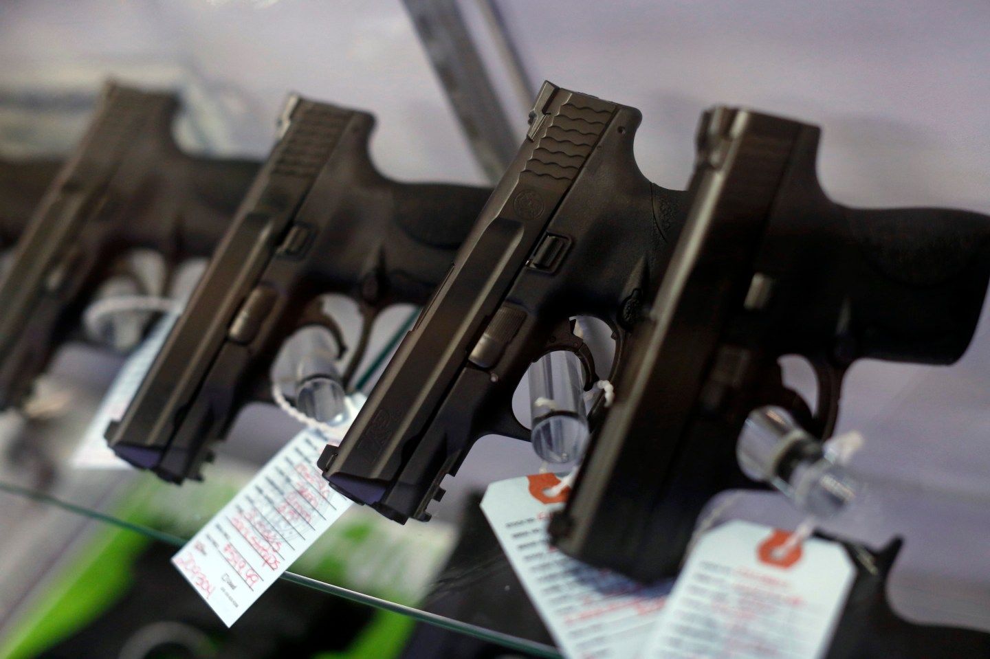 Handguns are seen for sale in a display case at Metro Shooting Supplies in Bridgeton