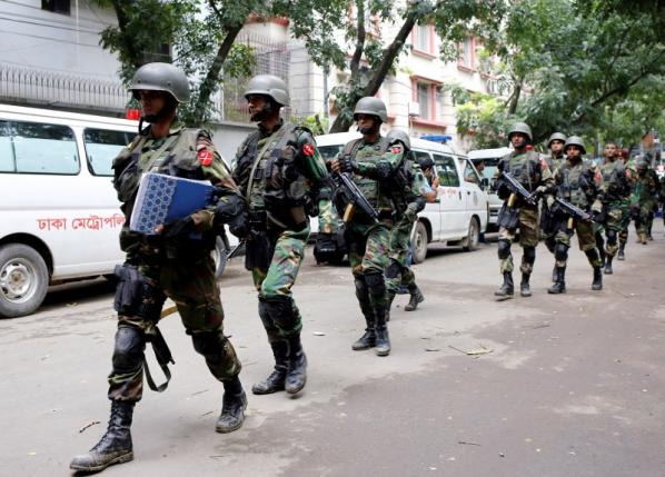 rmy soldiers patrol near the Holey Artisan restaurant after gunmen attacked the upscale cafe, in Dhaka