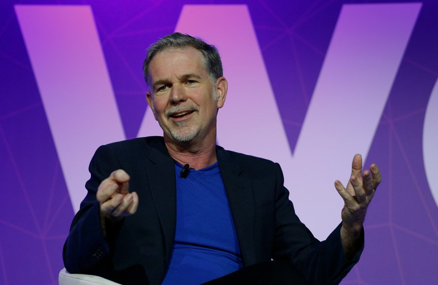 Netflix's CEO Hastings gestures as he delivers his keynote speech during Mobile World Congress in Barcelona
