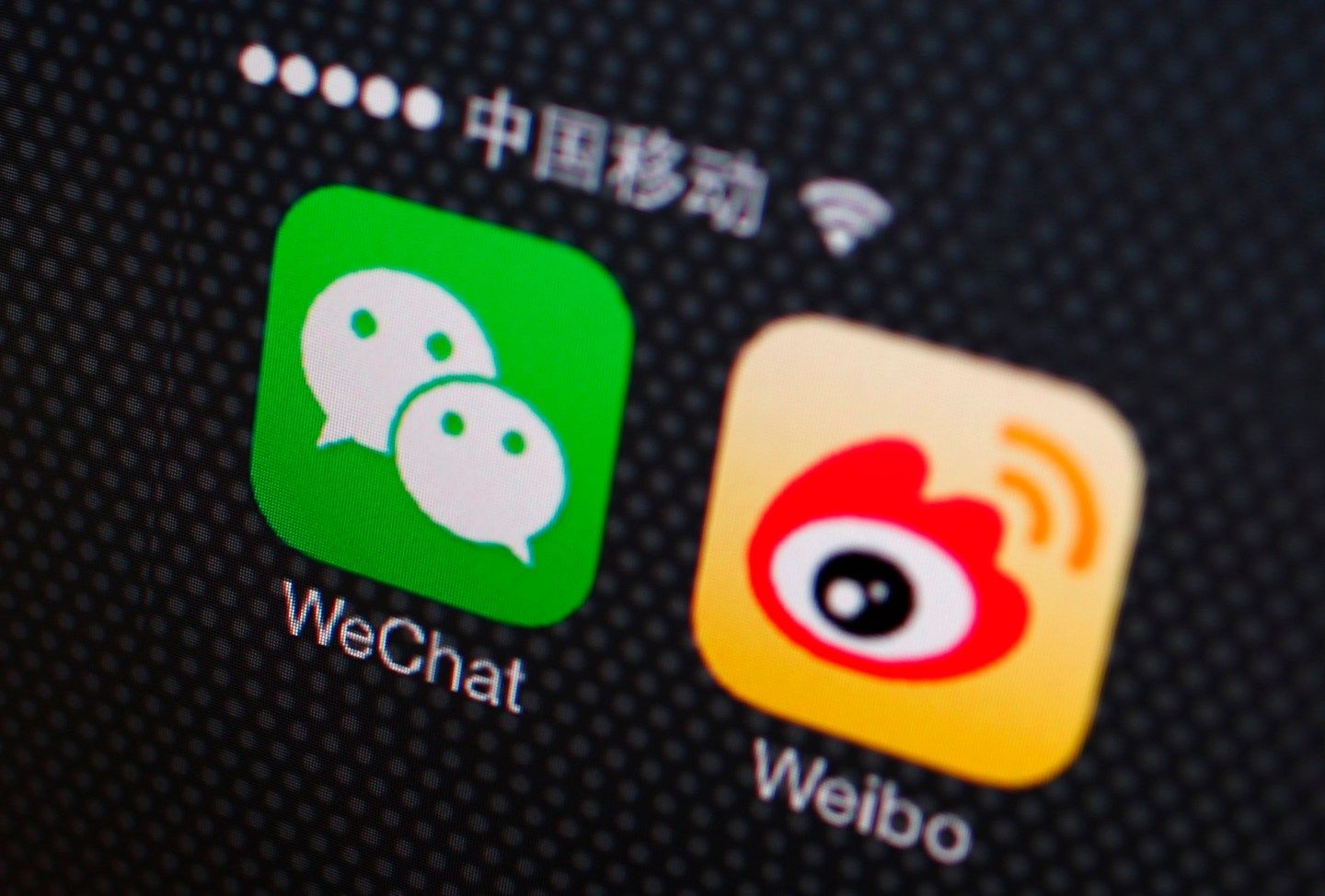 A picture illustration shows icons of WeChat and Weibo app in Beijing