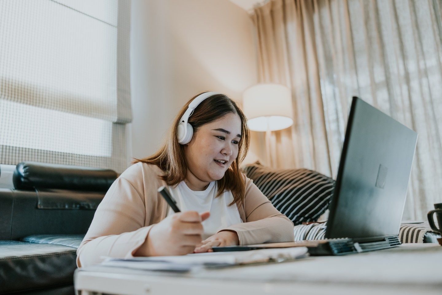Asian woman studying her first master's degree class, enjoy and happy to see her classmates.