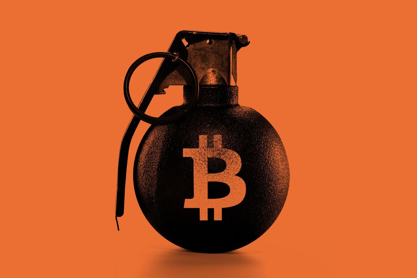 A grenade with a Bitcoin symbol painted on it.