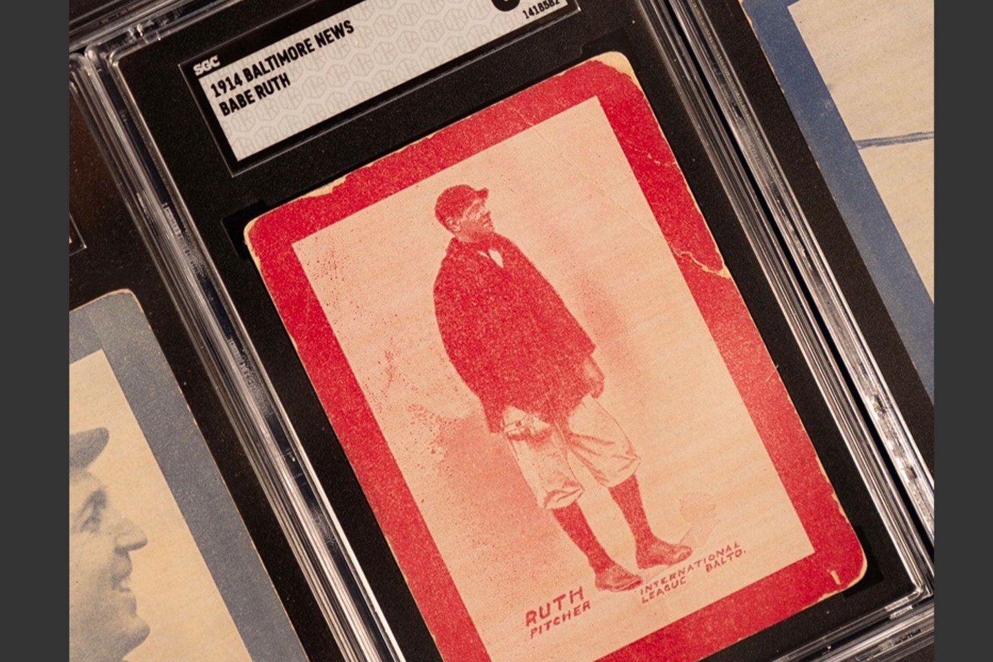 Photograph of a vintage baseball card showing the image of Babe Ruth