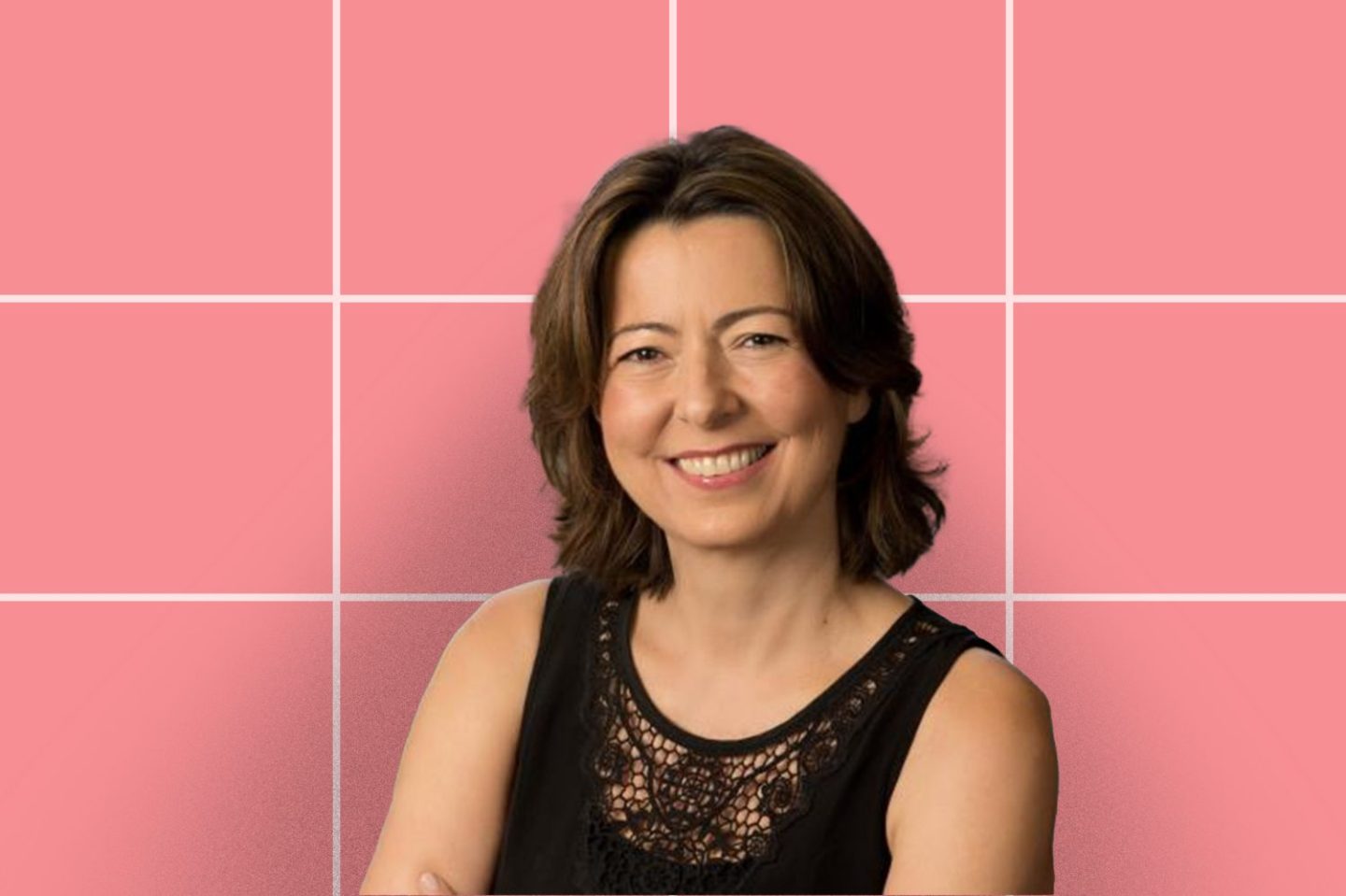 Head shot of Jelena Kovačević, dean of NYU's Tandon School of Engineering on a pink grid background