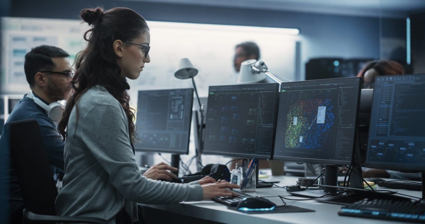 Data scientist works at a computer