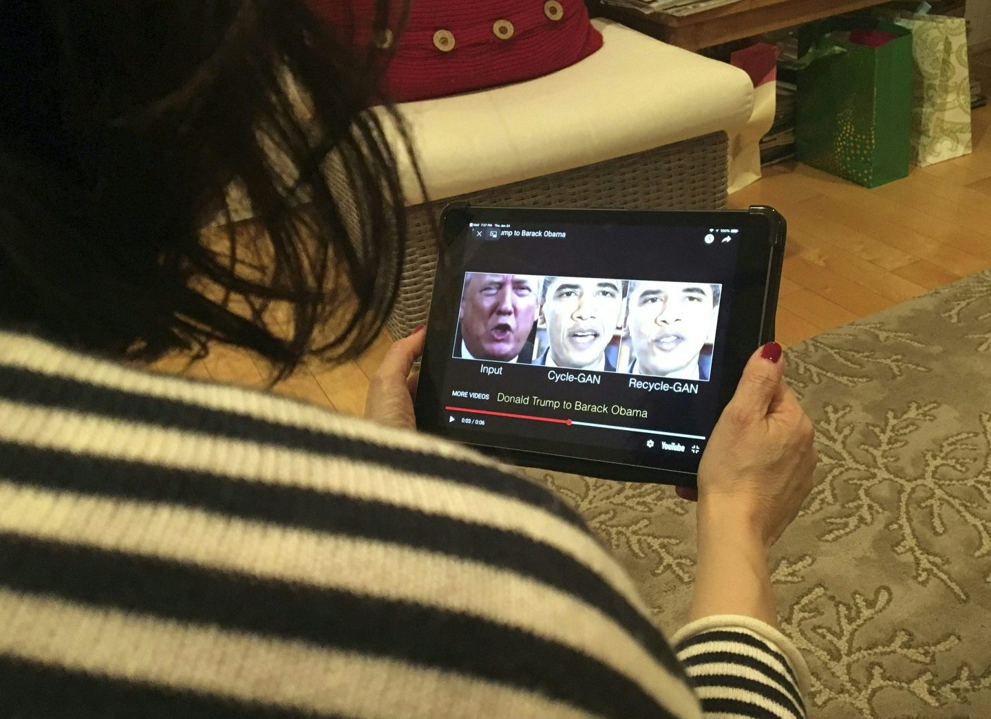 A woman in Washington, DC, views a manipulated video that changes what is said by President Donald Trump and former president Barack Obama, illustrating how deepfake technology can deceive viewers.